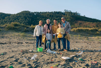 Group of volunteers ready to clean the beach