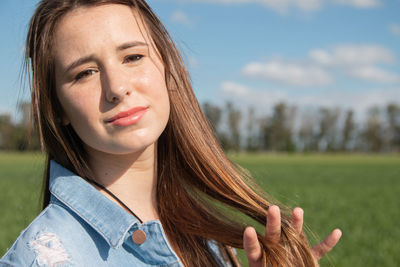 Portrait of young woman looking away