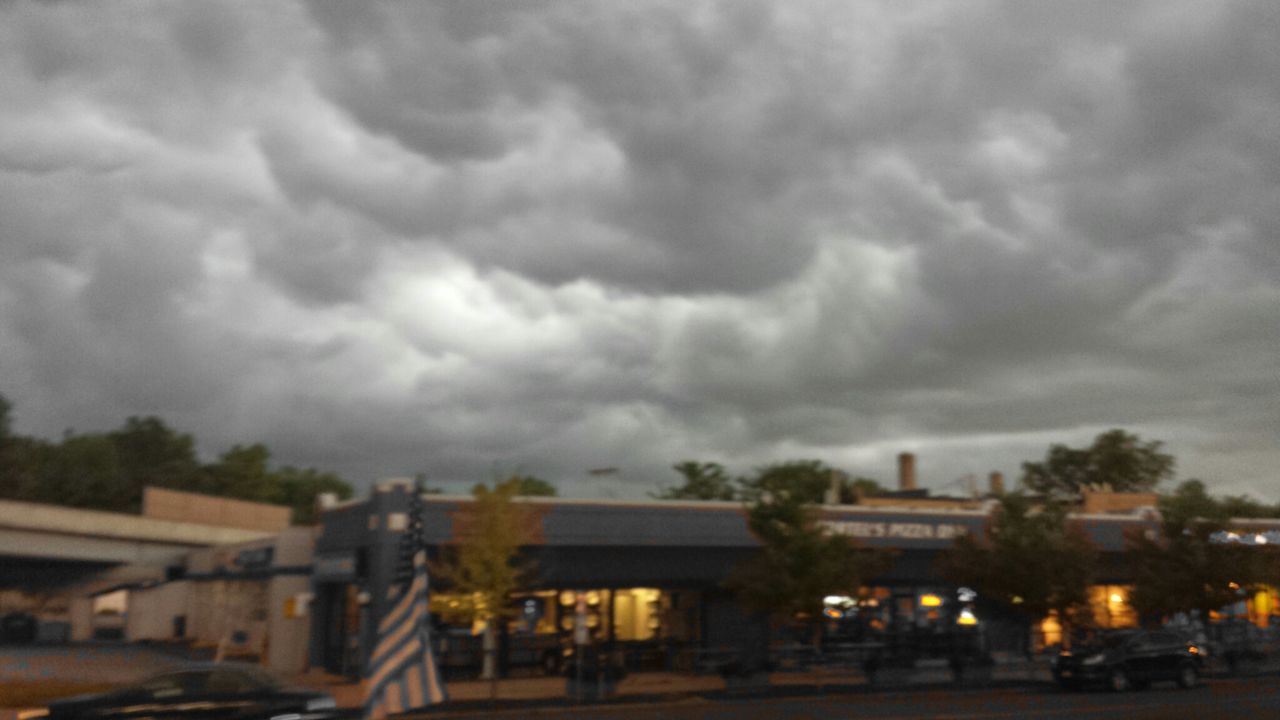 building exterior, architecture, built structure, sky, cloud - sky, cloudy, city, street, dusk, residential structure, cloud, road, weather, residential building, overcast, car, transportation, house, city life, storm cloud