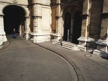 Tourists at entrance of historic building