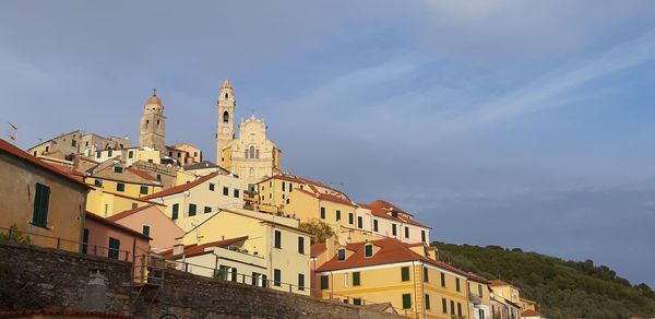 Buildings in city against sky