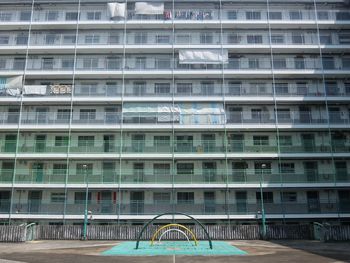 Playground against buildings in city