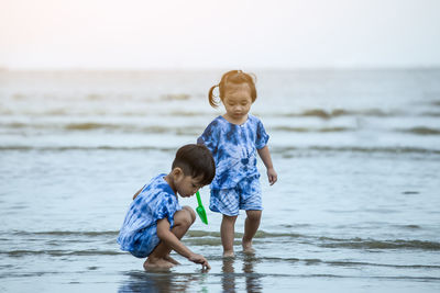 Full length of boys on beach