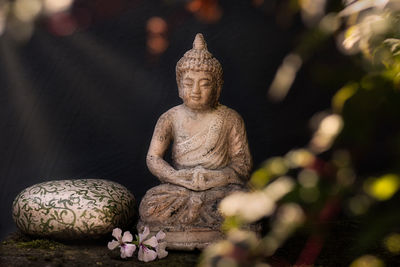 Close-up of statue against plants