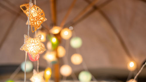 Low angle view of illuminated chandelier