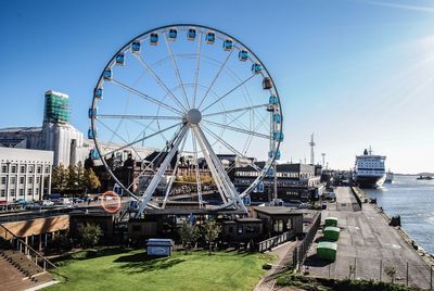 Ferris wheel against blue sky