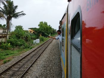 Train on railroad tracks against sky