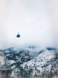 Scenic view of snow covered mountains against sky