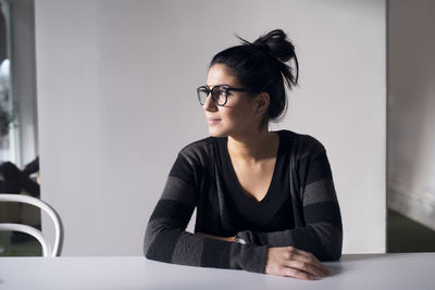 Woman in office looking away