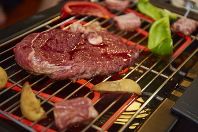 Close-up of meat on barbecue grill