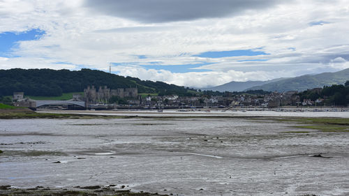 Scenic view of landscape and mountains against sky