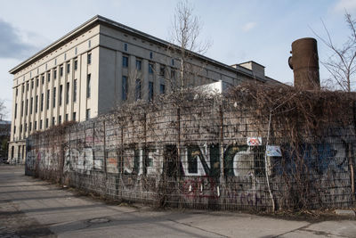 Abandoned building against sky in city