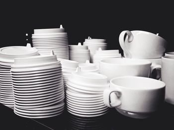 Close-up of coffee cups over black background