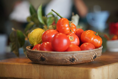 Close-up of tomatoes in basket on table