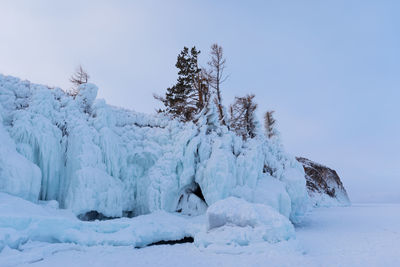 Scenic view of snow covered landscape against clear sky