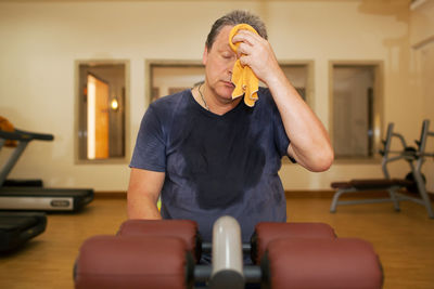 Mature man exercising at gym