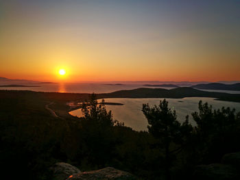 Scenic view of sunset over mountains