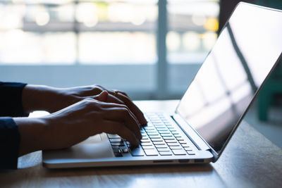 Man using laptop on table