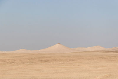 Scenic view of desert against clear sky