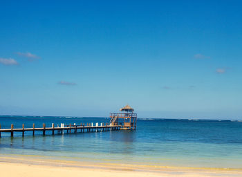 Scenic view of sea against blue sky