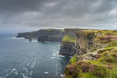 Iconic cliffs of moher with obriens tower on far distance, ireland