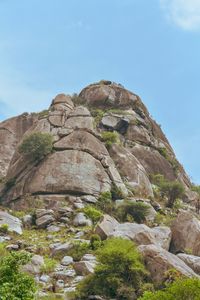 Low angle view of rock formations against sky