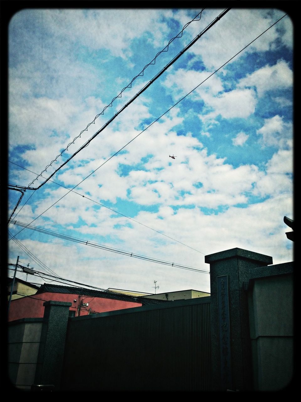 low angle view, sky, built structure, architecture, cloud - sky, building exterior, power line, cloud, cable, cloudy, transfer print, auto post production filter, electricity, roof, house, silhouette, connection, no people, outdoors, dusk