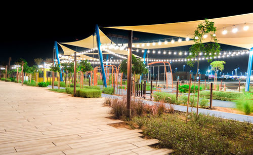 Empty footpath in park at night