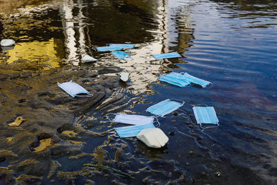 High angle view of garbage floating on water