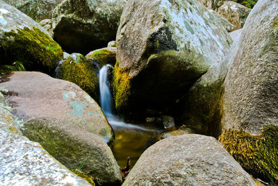 Close-up of water flowing through rocks