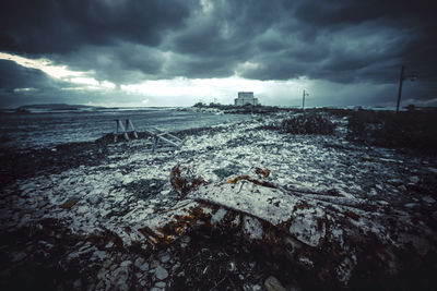 Abandoned beach against sky