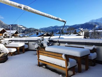 Scenic view of snowcapped mountains against clear blue sky