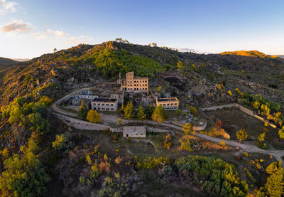 Drone aerial panorama of termas radium hotel serra da pena at sunset in sortelha, portugal