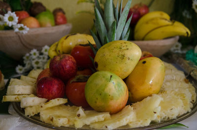 Close-up of fruits in container on table