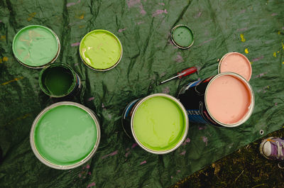 High angle view of various eggs on green table