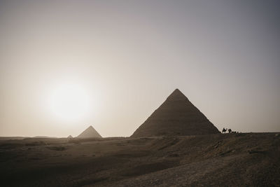 Egypt, cairo, giza pyramids at sunset