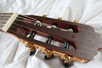 High angle view of piano on bed