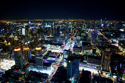 High angle view of illuminated city buildings at night