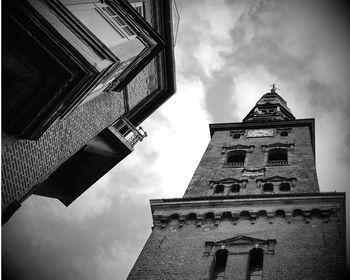 Low angle view of bell tower against sky