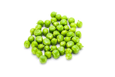 High angle view of green beans against white background