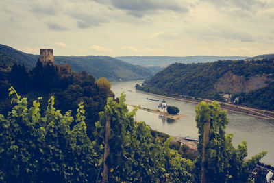 High angle view of river with mountains in background