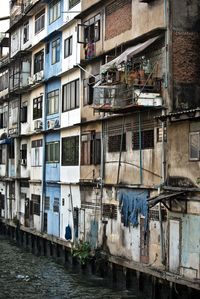 Buildings by canal in city