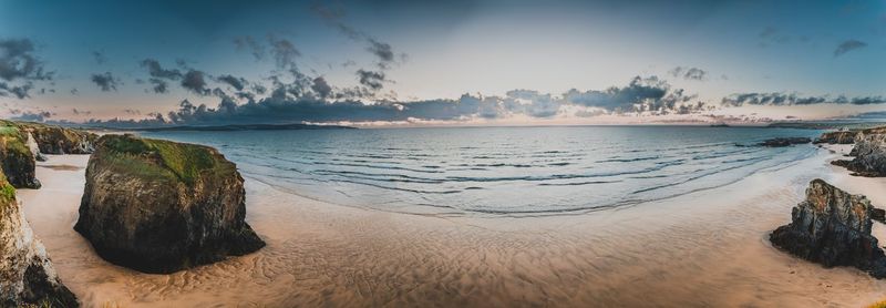 Panoramic view of sea against sky during sunset