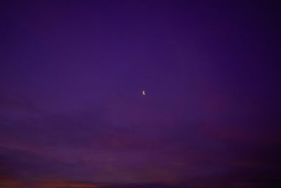 Low angle view of purple sky at night