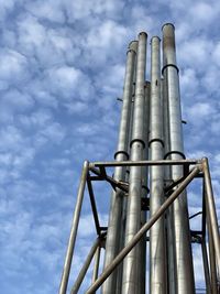 Low angle view of smoke stack against sky