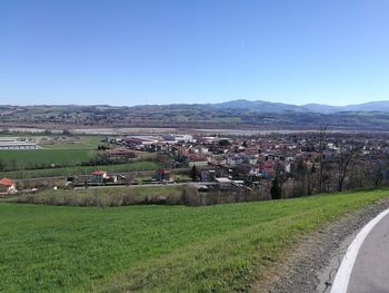 Scenic view of agricultural field against clear sky