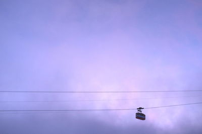 Low angle view of cable car against sky