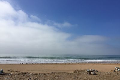 Scenic view of beach against sky