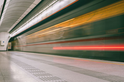 Blurred motion of train at railroad station