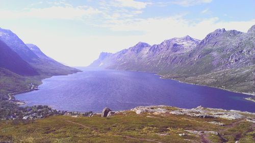 Scenic view of lake and mountains against sky